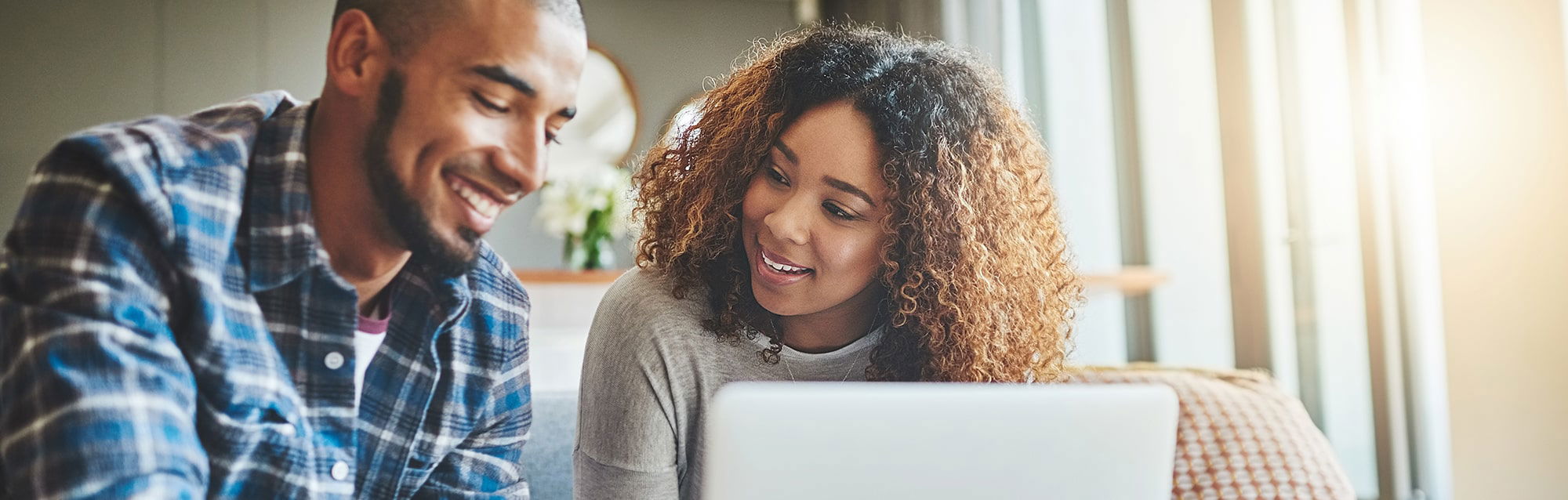 Couple looking at laptop